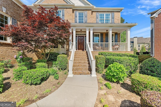 3456 Glen Mist Pl, Dacula, GA 30019 - view of front facade with a porch and brick siding