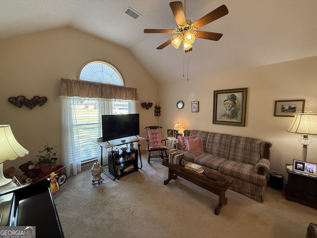 carpeted living area featuring lofted ceiling, healthy amount of natural light, and ceiling fan