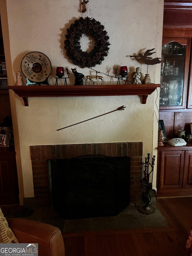 105 Chinquapin Ln, Clarkesville, GA 30523 - detailed view of a fireplace, wood finished floors, and a textured wall
