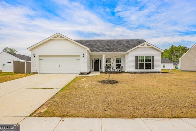 145 Gavin Way, Rincon, GA 31326 - view of front of house featuring a garage, driveway, a front lawn, and a porch