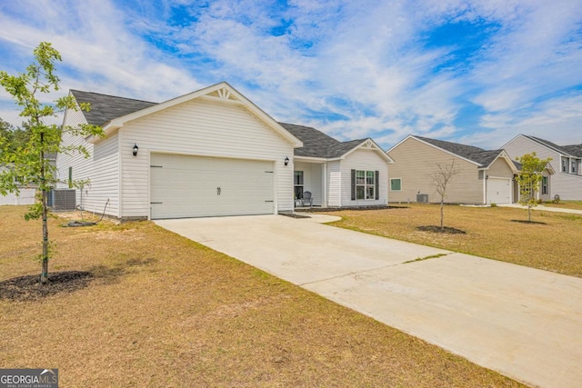 145 Gavin Way, Rincon, GA 31326 - view of front of house featuring a garage, driveway, cooling unit, a front yard, and roof with shingles