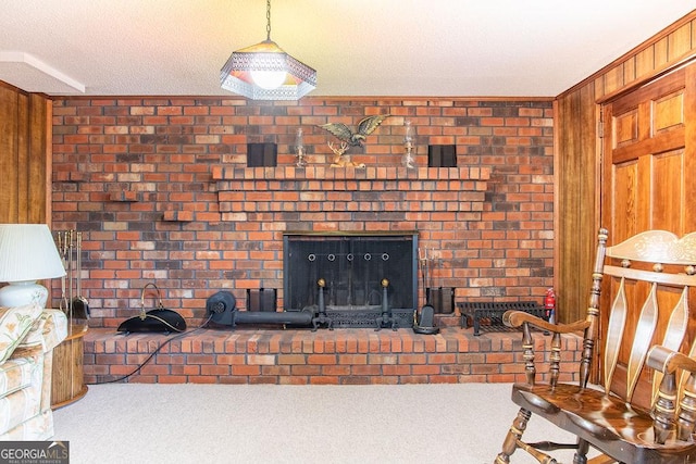 living room with carpet flooring, a fireplace, and wooden walls