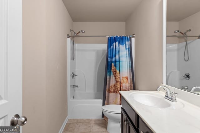 full bath with shower / tub combo, toilet, vanity, tile patterned floors, and baseboards