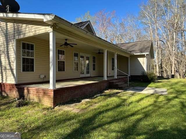 2506 Wateringhole Ct, Statesboro, GA 30458 - rear view of house with ceiling fan, a yard, french doors, and a patio