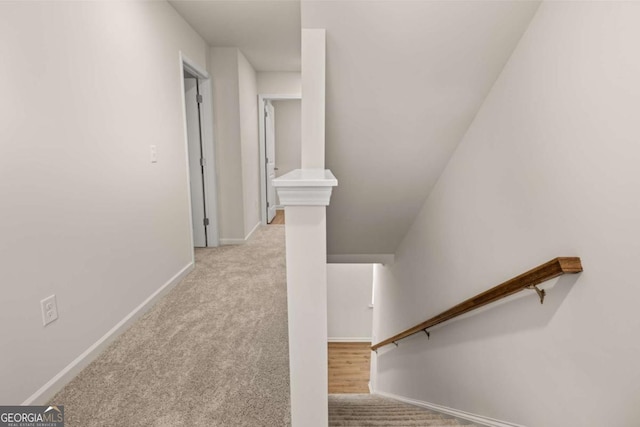 stairs with carpet and baseboards