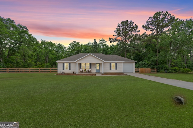 single story home featuring a porch, concrete driveway, and an attached garage