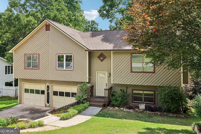2958 Cordite Loop, Snellville, GA 30039 - split foyer home with a front lawn, asphalt driveway, an attached garage, and roof with shingles