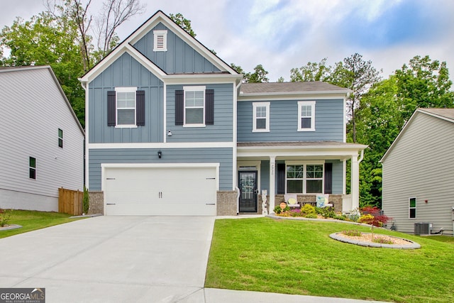 craftsman house featuring board and batten siding, covered porch, central air condition unit, driveway, and a front lawn