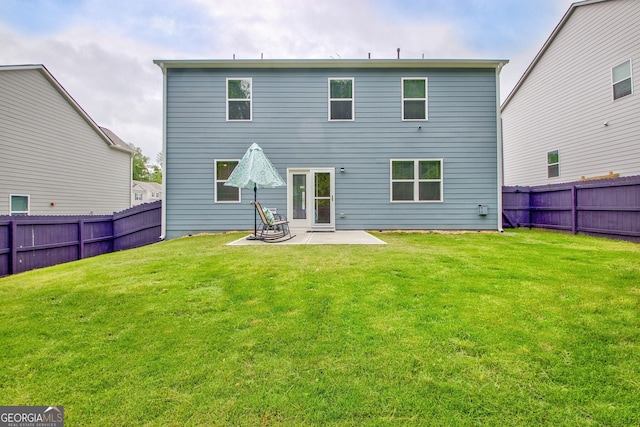 back of house with a patio