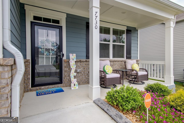 doorway to property with covered porch