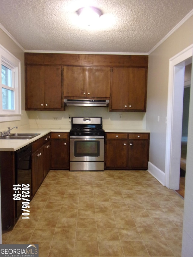 kitchen featuring stainless steel gas range, a sink, a textured ceiling, light countertops, and ornamental molding