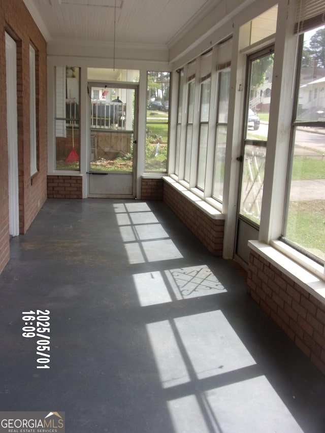 unfurnished sunroom featuring plenty of natural light