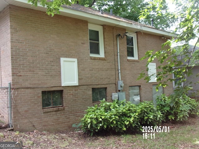 view of home's exterior with brick siding