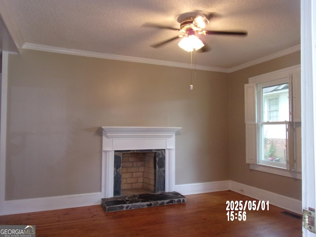 unfurnished living room with ceiling fan, a textured ceiling, wood finished floors, baseboards, and ornamental molding