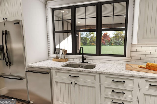 6586 Kenimer Rd, Clermont, GA 30527 - kitchen with stainless steel fridge, a sink, decorative backsplash, and white cabinetry