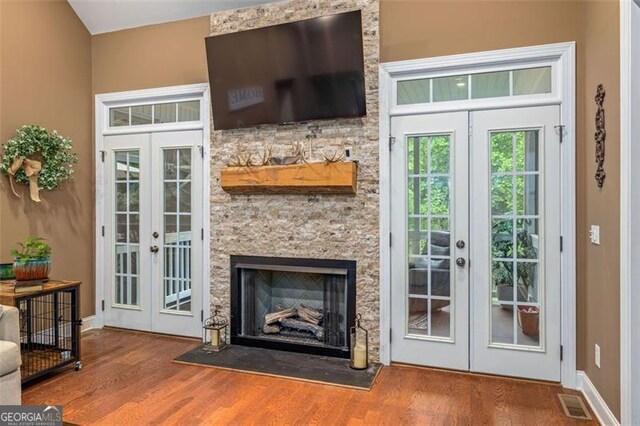 930 Brenau Point Dr, Gainesville, GA 30501 - doorway with french doors, wood finished floors, baseboards, and a fireplace
