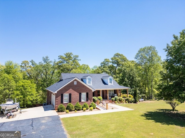 637 Lakeview Dr, Newborn, GA 30056 - new england style home with driveway, brick siding, a front lawn, a porch, and a garage