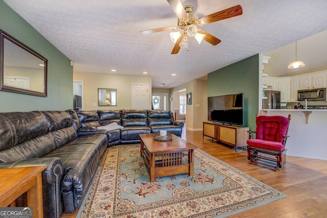 637 Lakeview Dr, Newborn, GA 30056 - living room with a textured ceiling, light wood-style floors, ceiling fan, and recessed lighting