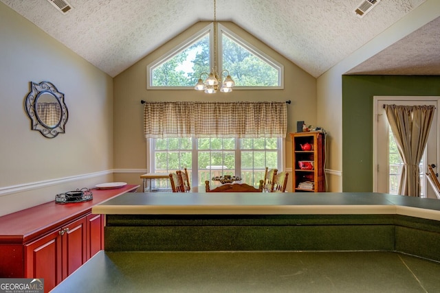 637 Lakeview Dr, Newborn, GA 30056 - office area featuring a textured ceiling, a chandelier, lofted ceiling, and plenty of natural light