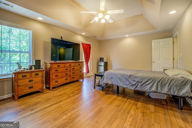 637 Lakeview Dr, Newborn, GA 30056 - bedroom with a tray ceiling, light wood-type flooring, ceiling fan, baseboards, and recessed lighting