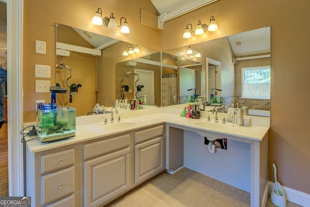 637 Lakeview Dr, Newborn, GA 30056 - full bath with vaulted ceiling, tile patterned floors, and double vanity