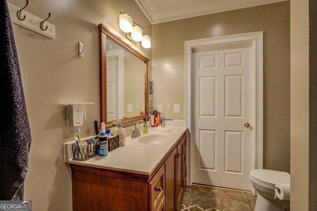 637 Lakeview Dr, Newborn, GA 30056 - bathroom featuring vanity, crown molding, and toilet