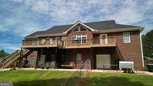 637 Lakeview Dr, Newborn, GA 30056 - back of house with brick siding, stairway, a patio area, a lawn, and a deck