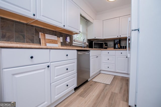 4529 Lakeview Dr, Powder Springs, GA 30127 - kitchen featuring stainless steel appliances, crown molding, white cabinetry, light wood-style floors, and backsplash