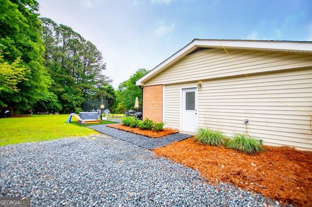 4529 Lakeview Dr, Powder Springs, GA 30127 - view of home's exterior featuring a lawn and brick siding