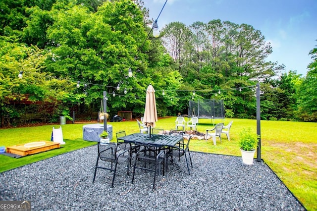 4529 Lakeview Dr, Powder Springs, GA 30127 - view of patio / terrace featuring a trampoline and outdoor dining area