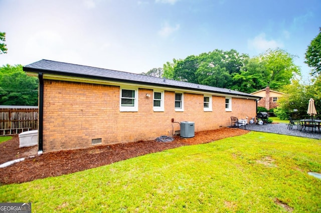 4529 Lakeview Dr, Powder Springs, GA 30127 - rear view of house featuring crawl space, brick siding, and a patio area