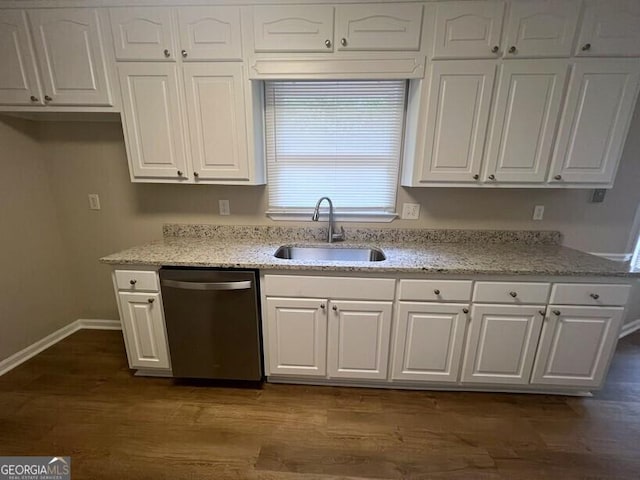 kitchen with dishwasher, a sink, and white cabinets