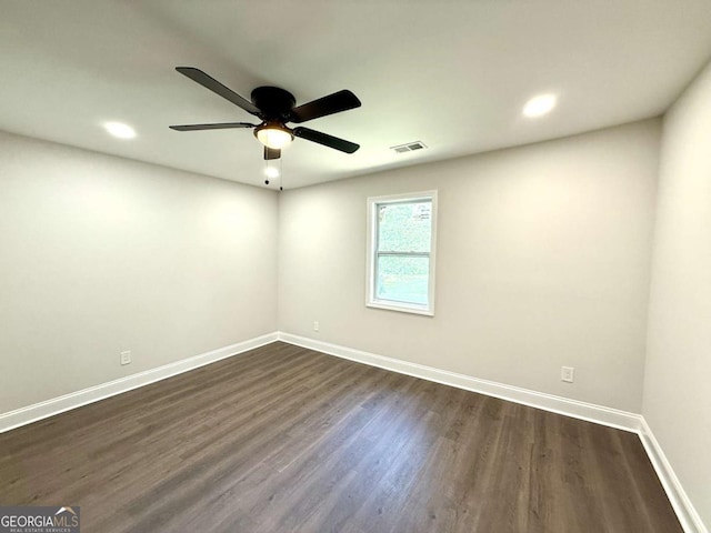 unfurnished room with baseboards, dark wood finished floors, a ceiling fan, and recessed lighting