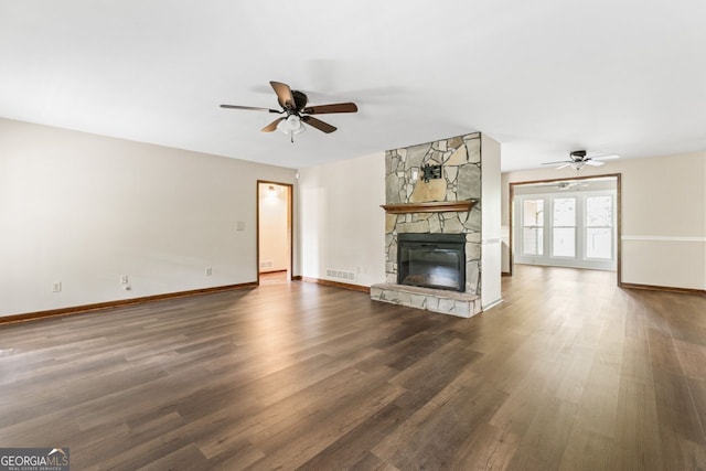 368 Henry Higgins Rd, Jackson, GA 30233 - unfurnished living room with a ceiling fan, dark wood-type flooring, and a fireplace
