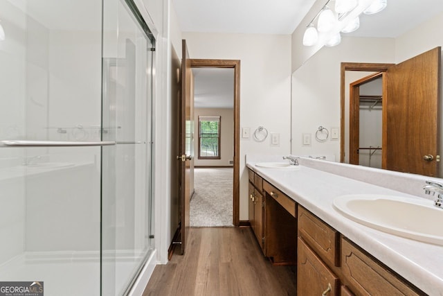 368 Henry Higgins Rd, Jackson, GA 30233 - full bath featuring wood finished floors, a stall shower, and double vanity