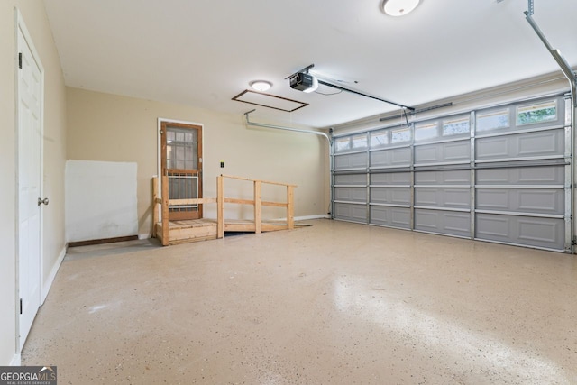 368 Henry Higgins Rd, Jackson, GA 30233 - garage with baseboards and a garage door opener