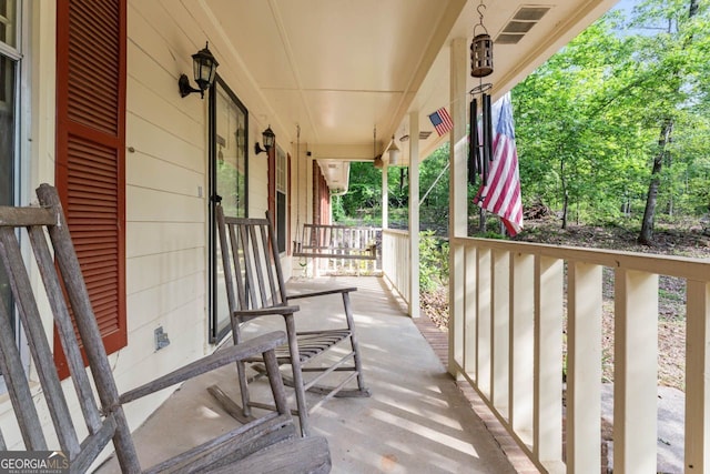 balcony featuring covered porch