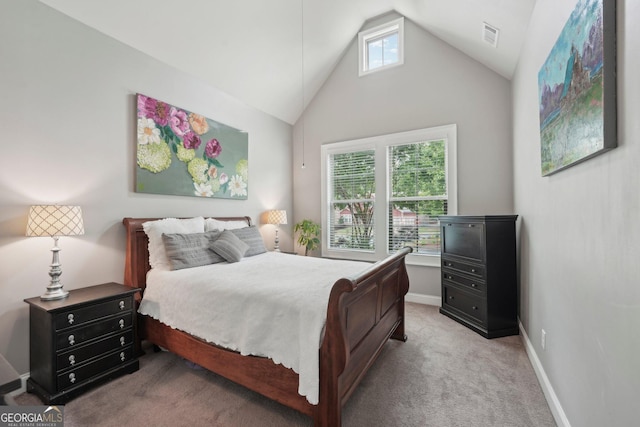 carpeted bedroom with lofted ceiling and baseboards