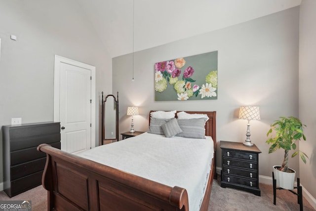 bedroom with light carpet, baseboards, and lofted ceiling