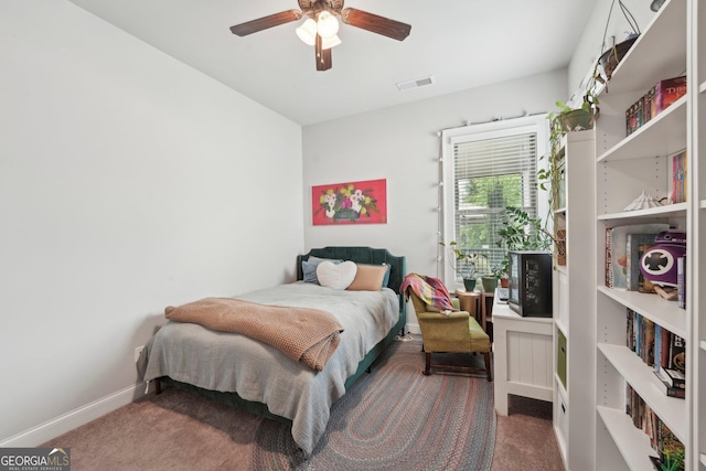 carpeted bedroom with baseboards and ceiling fan