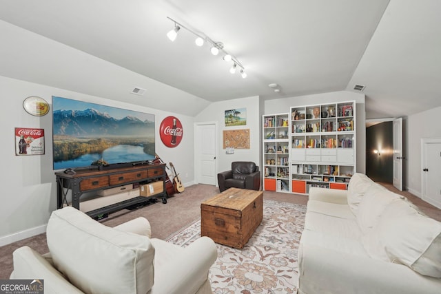 living area featuring vaulted ceiling, baseboards, carpet floors, and rail lighting