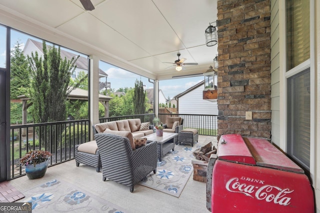 sunroom / solarium featuring an outdoor living space and ceiling fan