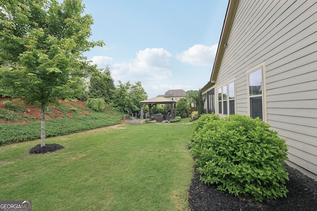 view of grassy yard featuring a gazebo