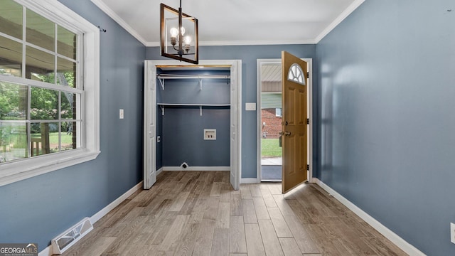 19 Fernwood Way NE, Rome, GA 30161 - doorway featuring wood finished floors, baseboards, ornamental molding, and a chandelier