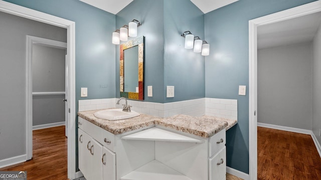 19 Fernwood Way NE, Rome, GA 30161 - bathroom featuring wood finished floors, vanity, backsplash, and baseboards