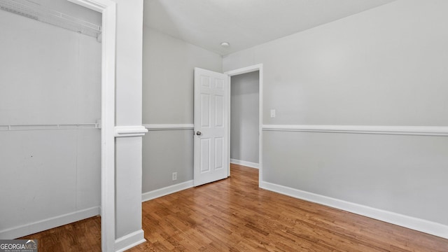 19 Fernwood Way NE, Rome, GA 30161 - unfurnished bedroom with wood finished floors, a closet, and baseboards