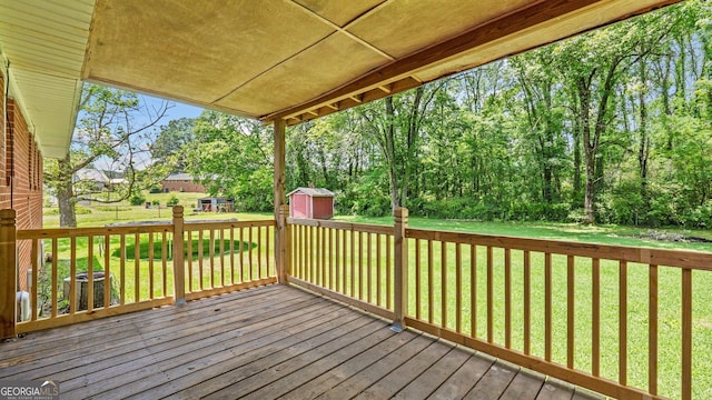 19 Fernwood Way NE, Rome, GA 30161 - wooden deck featuring a storage shed, an outbuilding, and a yard