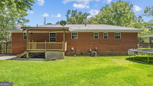 19 Fernwood Way NE, Rome, GA 30161 - rear view of property featuring a trampoline, crawl space, metal roof, and a wooden deck
