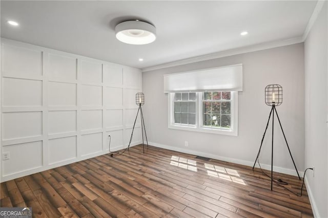 unfurnished bedroom featuring crown molding, dark wood-style flooring, baseboards, and recessed lighting
