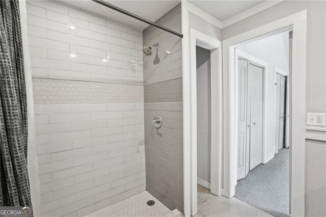 bathroom with tiled shower